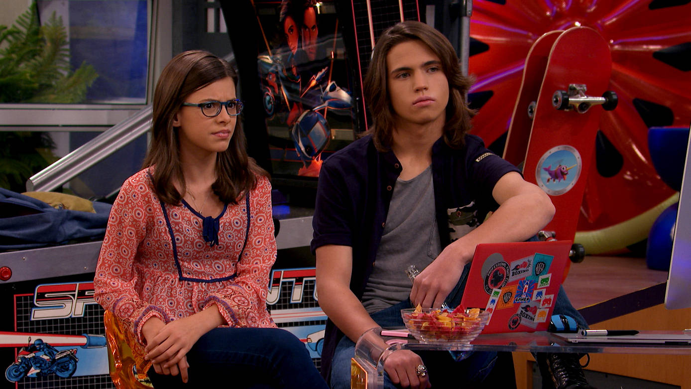 Kenzie And Scott In A Scene From Game Shakers Background