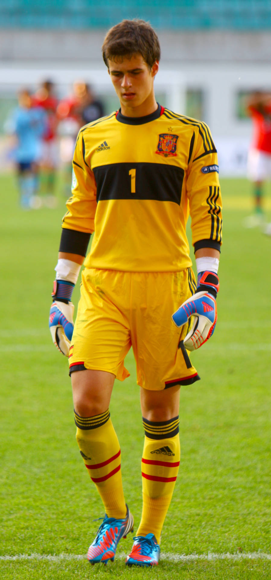 Kepa Arrizabalaga Standing Confident On The Pitch Background