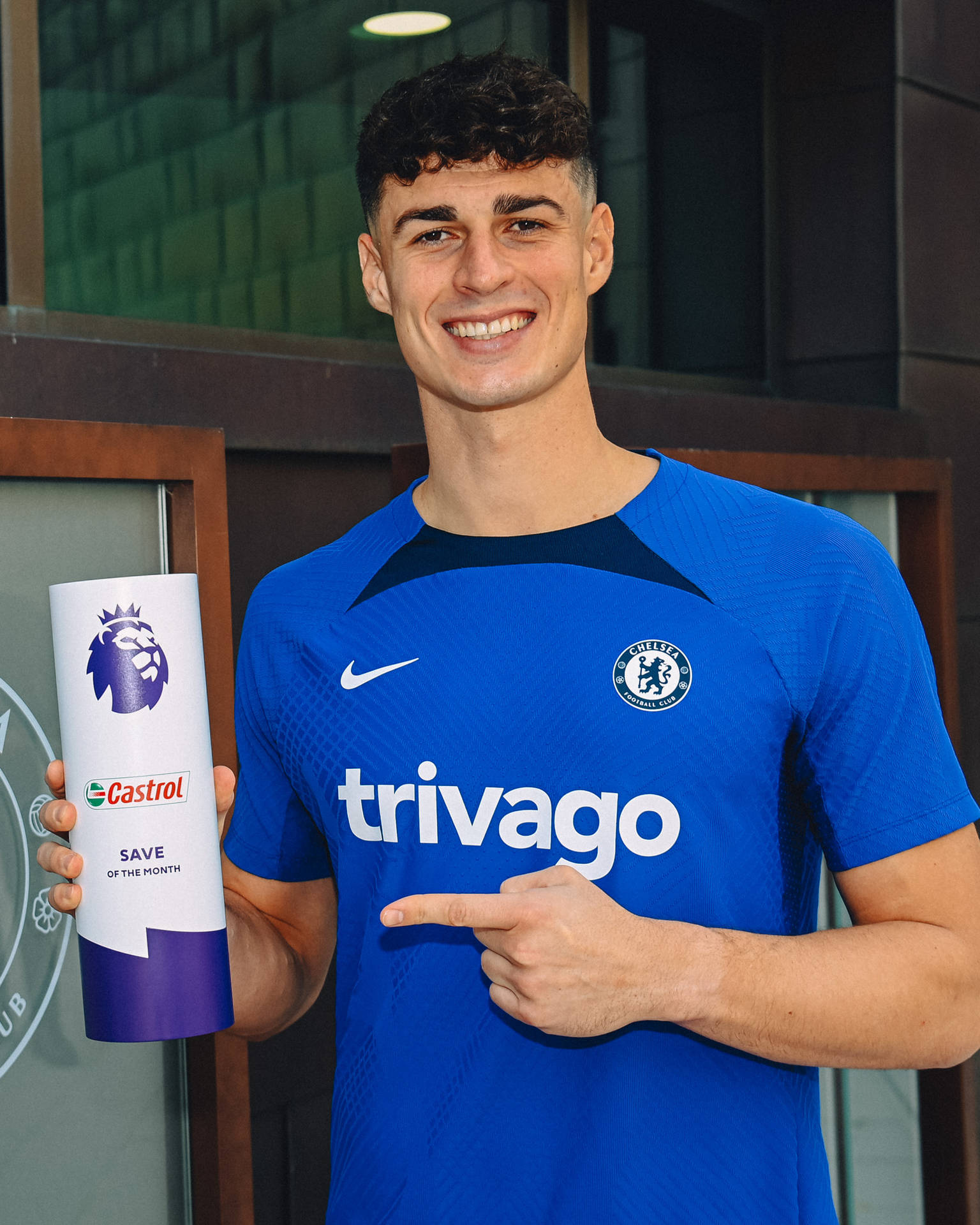 Kepa Arrizabalaga Triumphantly Holding An Award