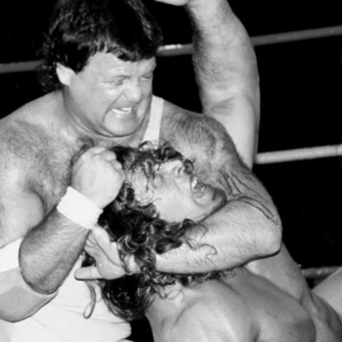 Kerry Von Erich Wrestling With Jerry Lawler Background