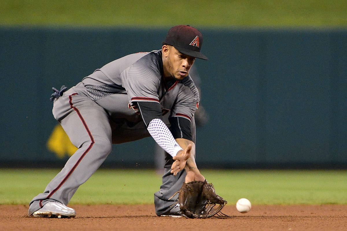 Ketel Marte Making An Exceptional Catch In A Baseball Game Background