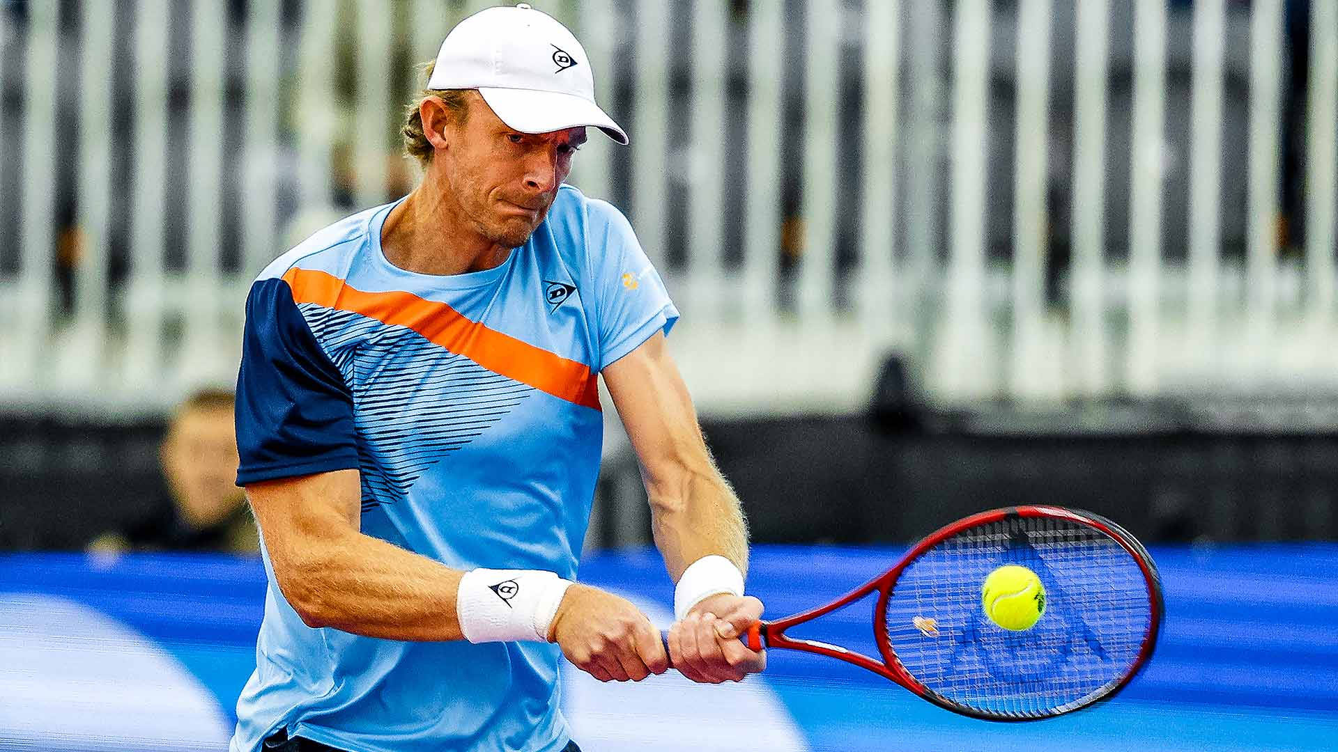 Kevin Anderson In Action During A Tennis Match Background