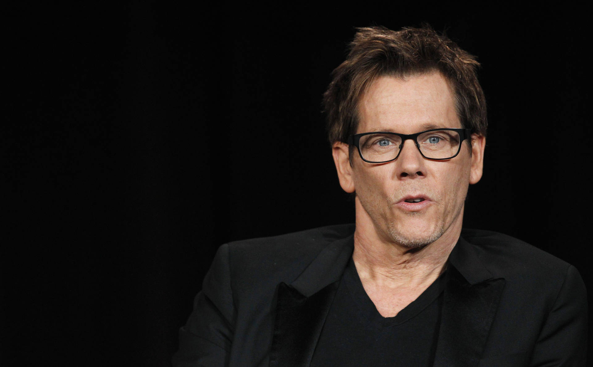 Kevin Bacon In Black Background