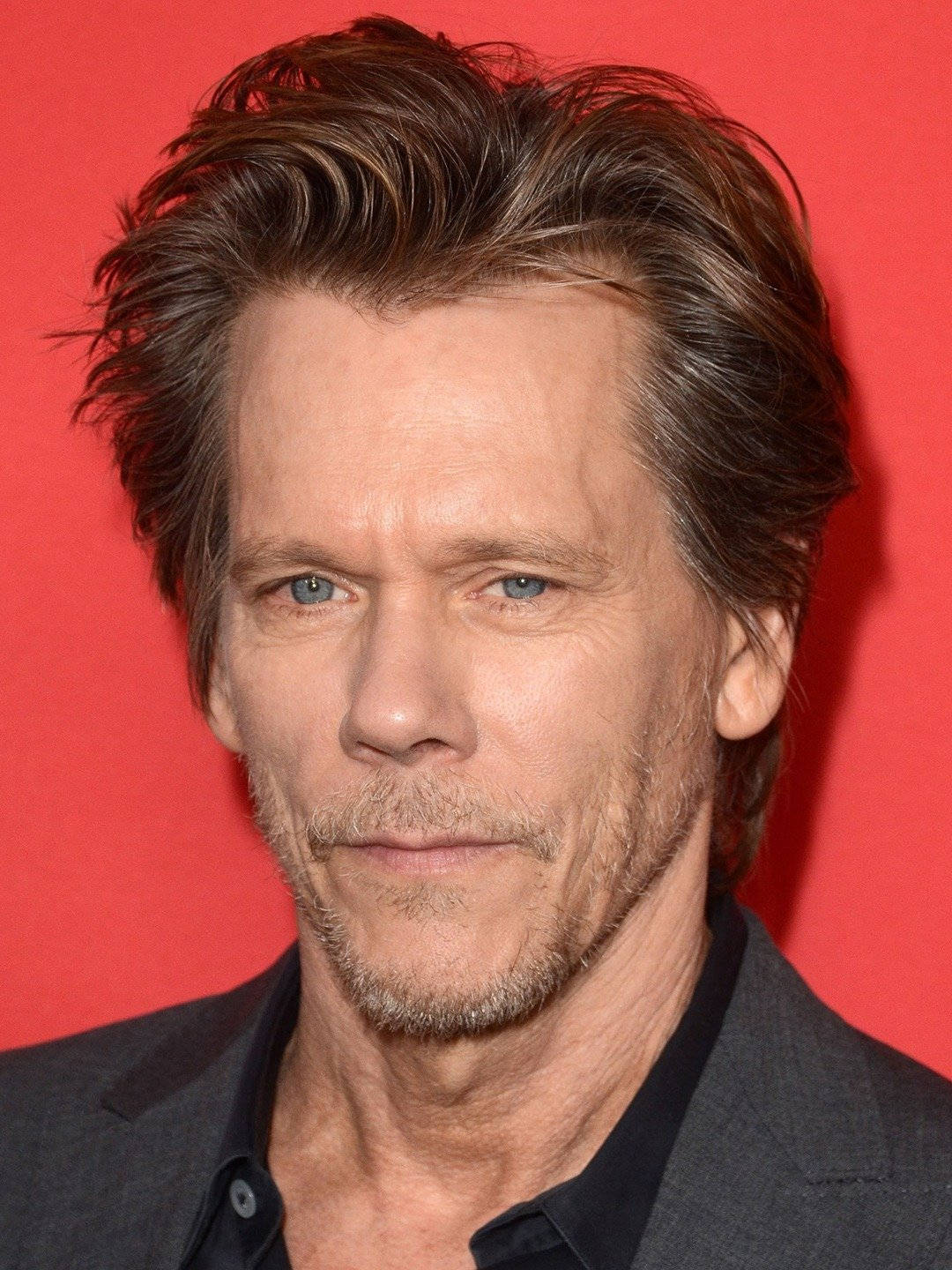 Kevin Bacon In Red Background