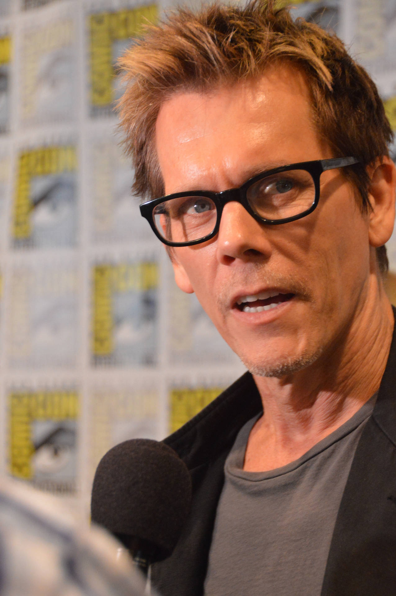 Kevin Bacon, The Renowned Hollywood Actor, Striking A Charismatic Pose Background