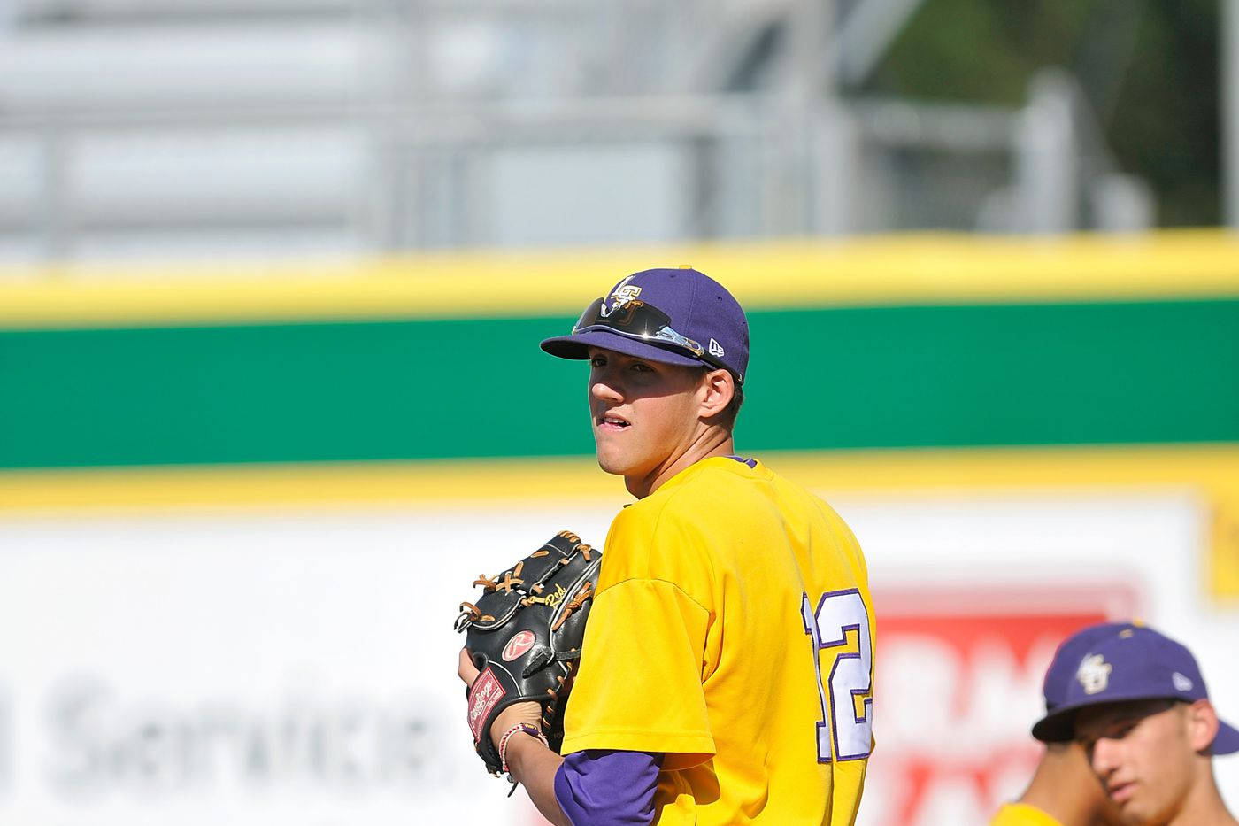 Kevin Gausman In College Yellow Jersey Background