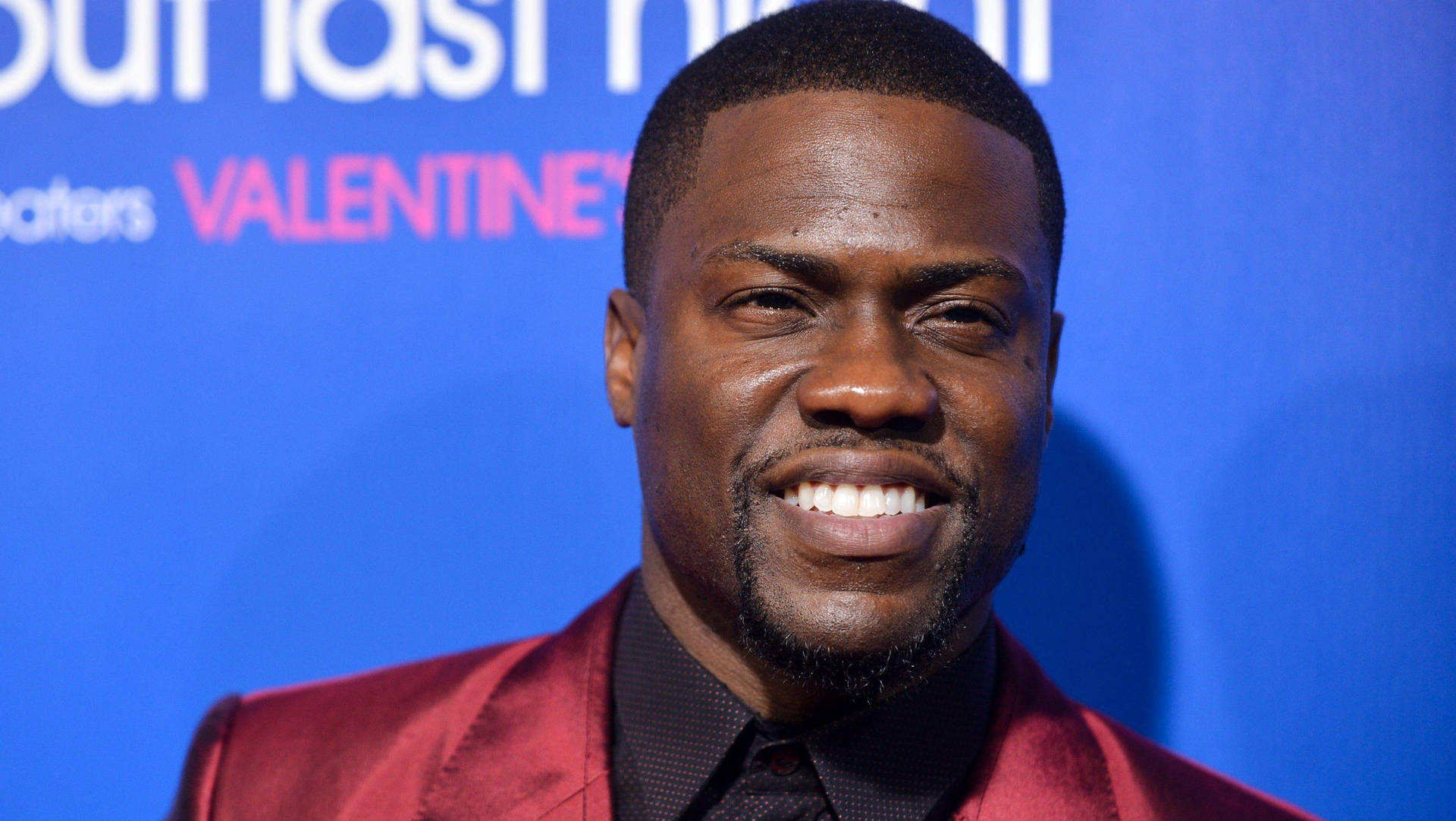 Kevin Hart In Red Suit Background