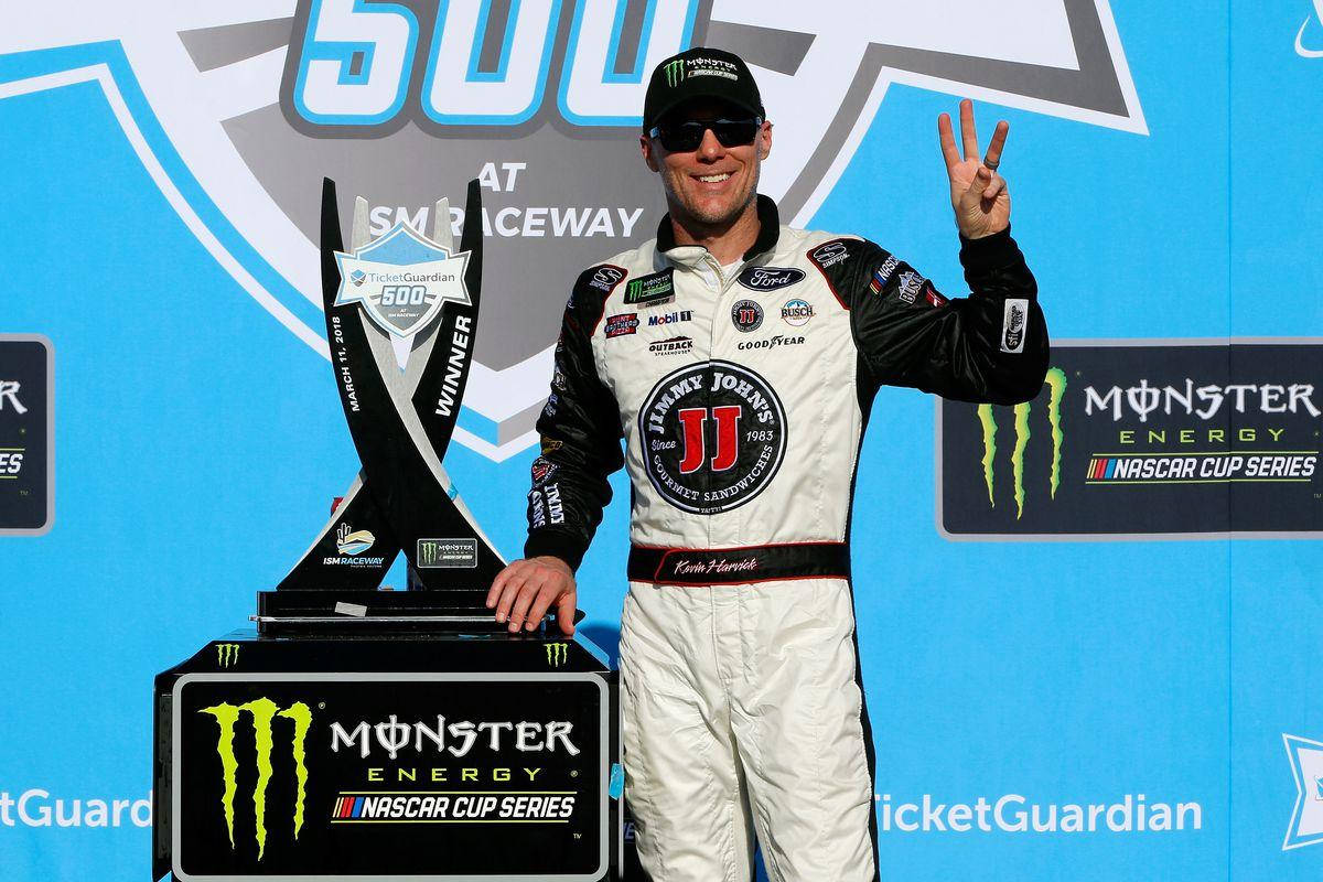 Kevin Harvick Posing With His Championship Trophy Background