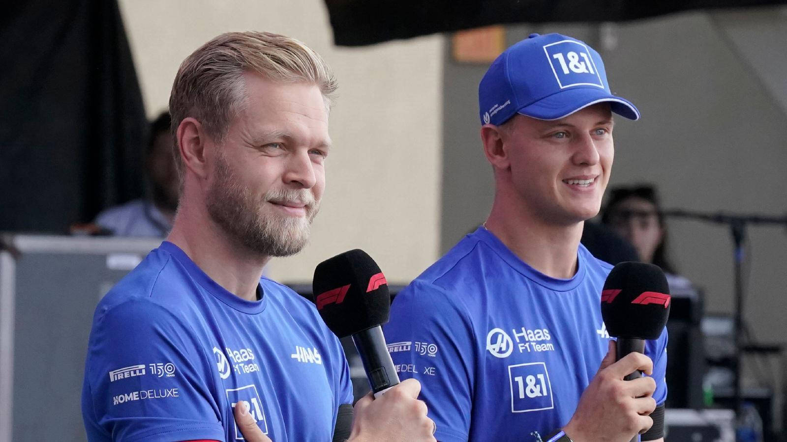 Kevin Magnussen And Schumacher With Microphones Background