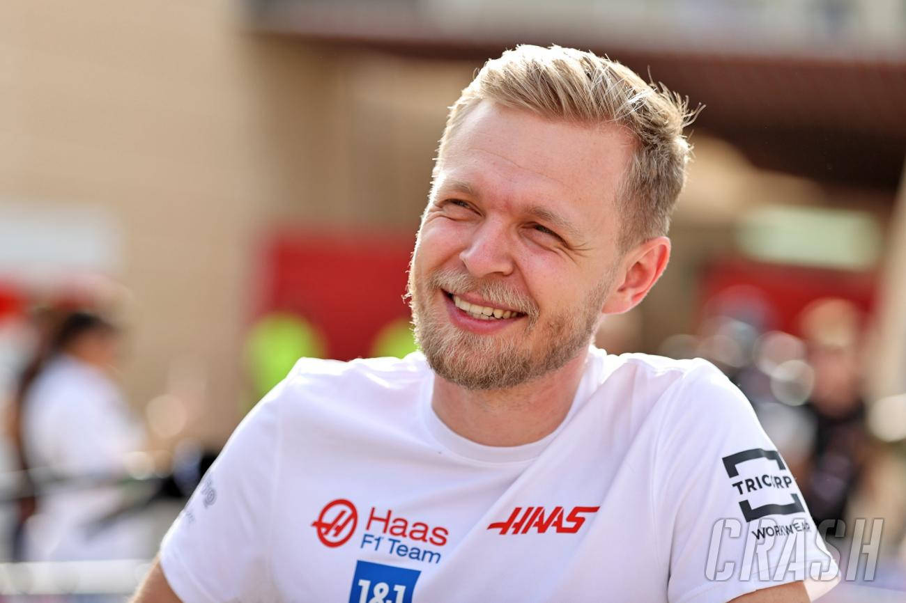 Kevin Magnussen Dressed In A White Haas Shirt. Background