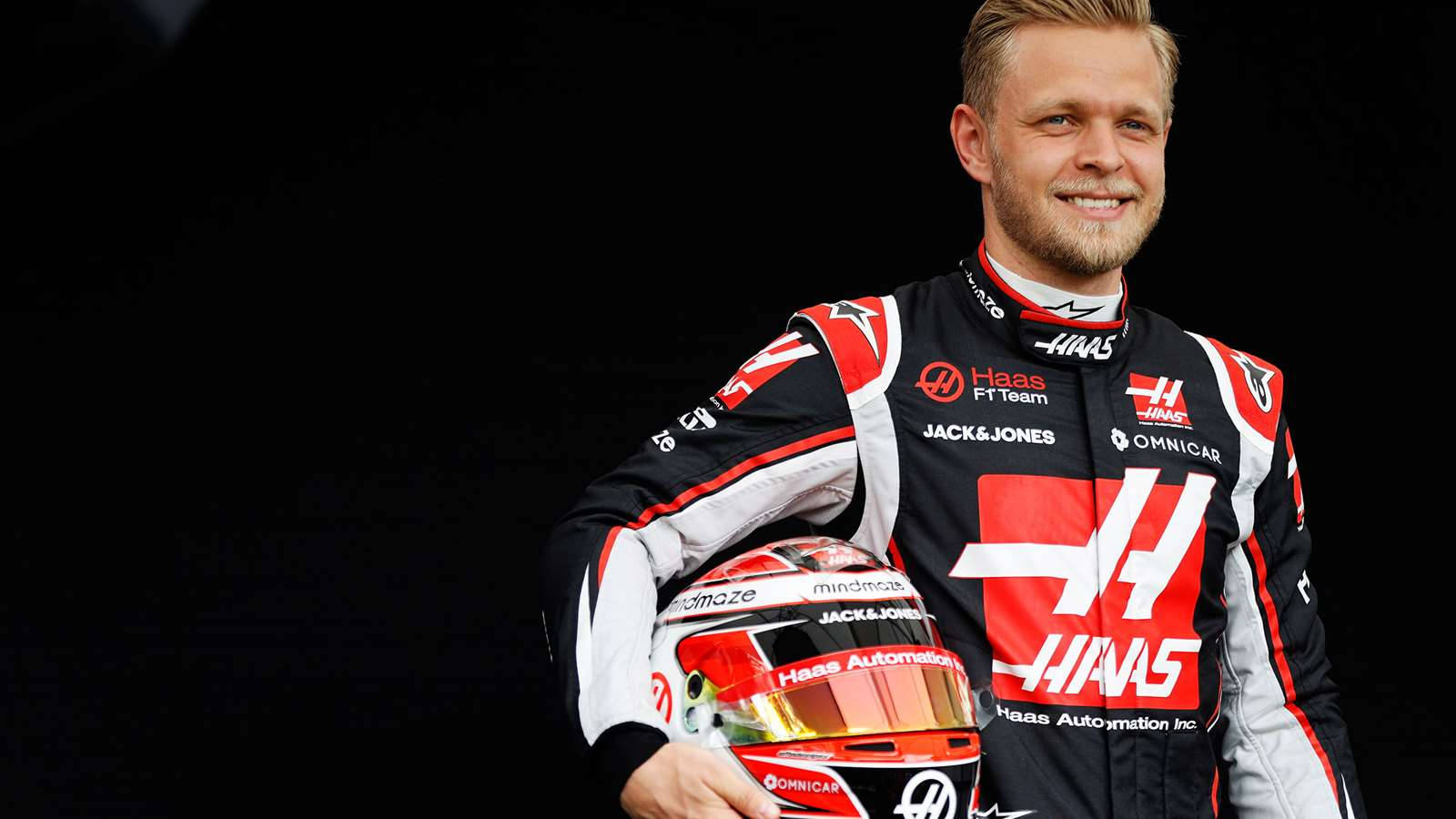 Kevin Magnussen Holding His Helmet In Confidence