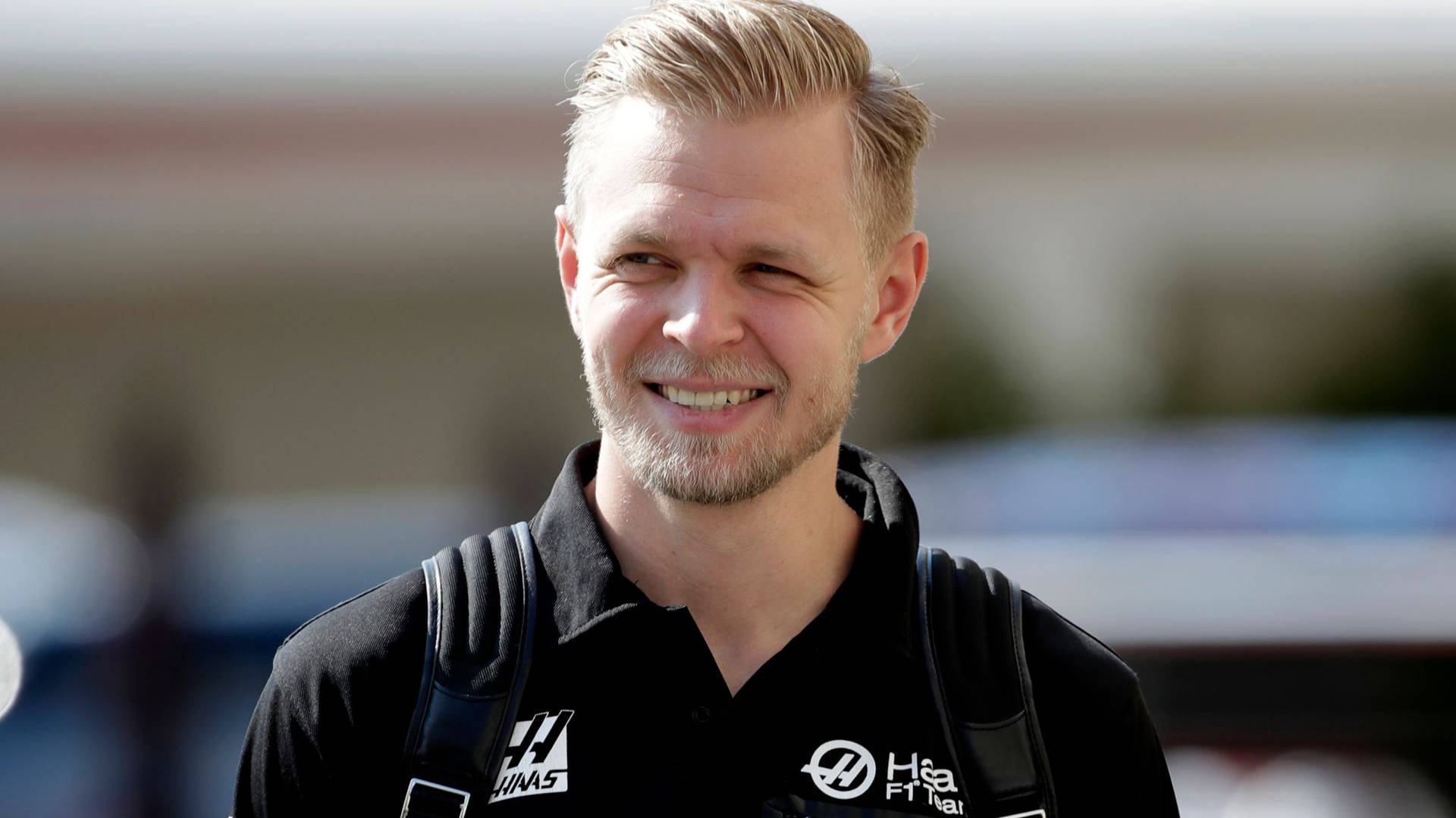 Kevin Magnussen In A Haas Shirt Background