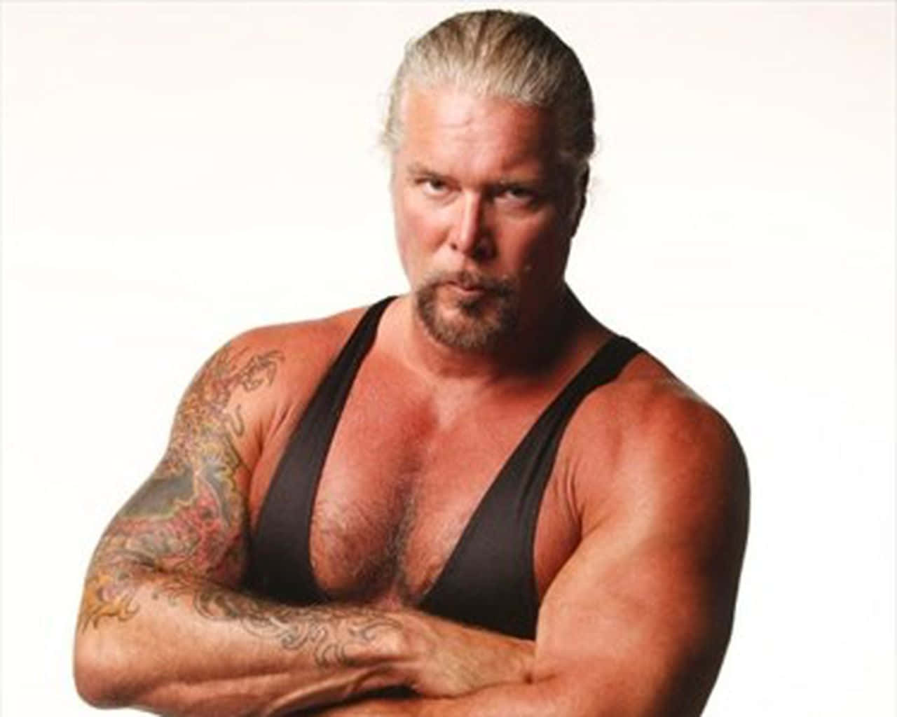 Kevin Nash Posing With Crossed Hands Background