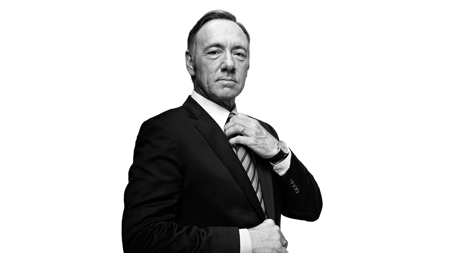 Kevin Spacey Adjusting His Necktie Background