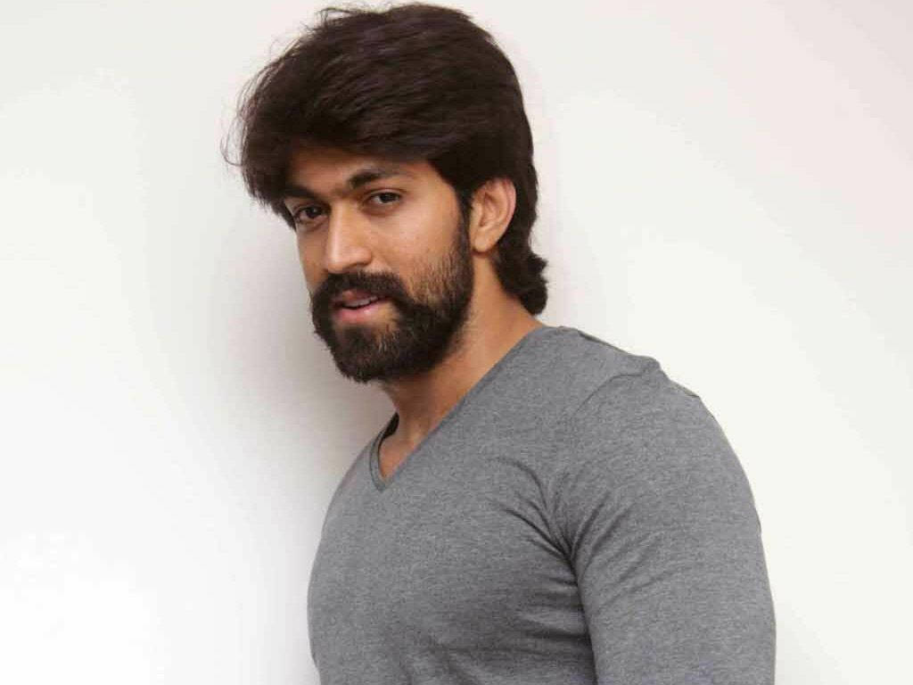 Kgf Star Yash In An Intense Look Background