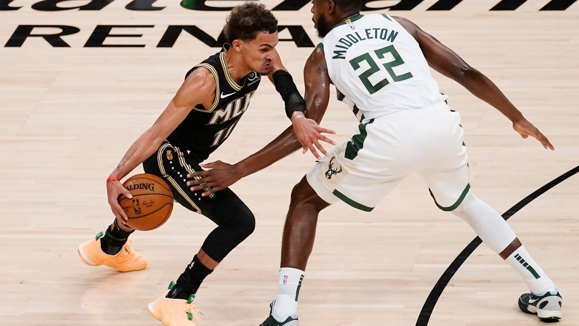 Khris Middleton Vs. Trae Young Background