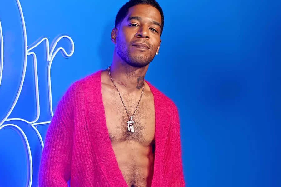 Kid Cudi Pink Cardigan Blue Backdrop