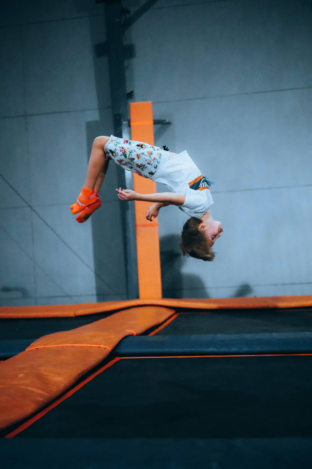 Kid Flip Jumping On A Trampoline