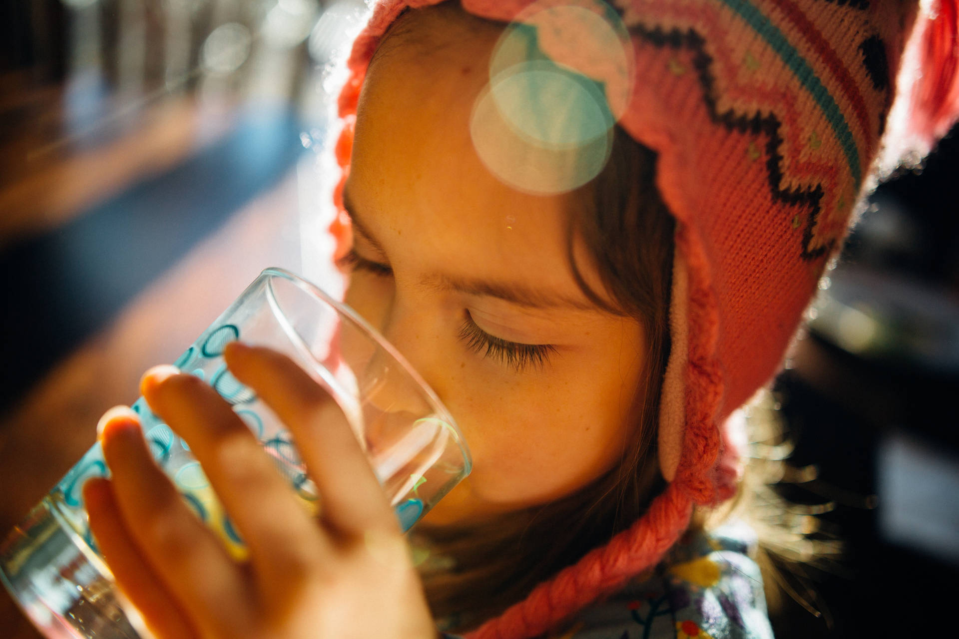 Kid With Hat Drinking Water Background