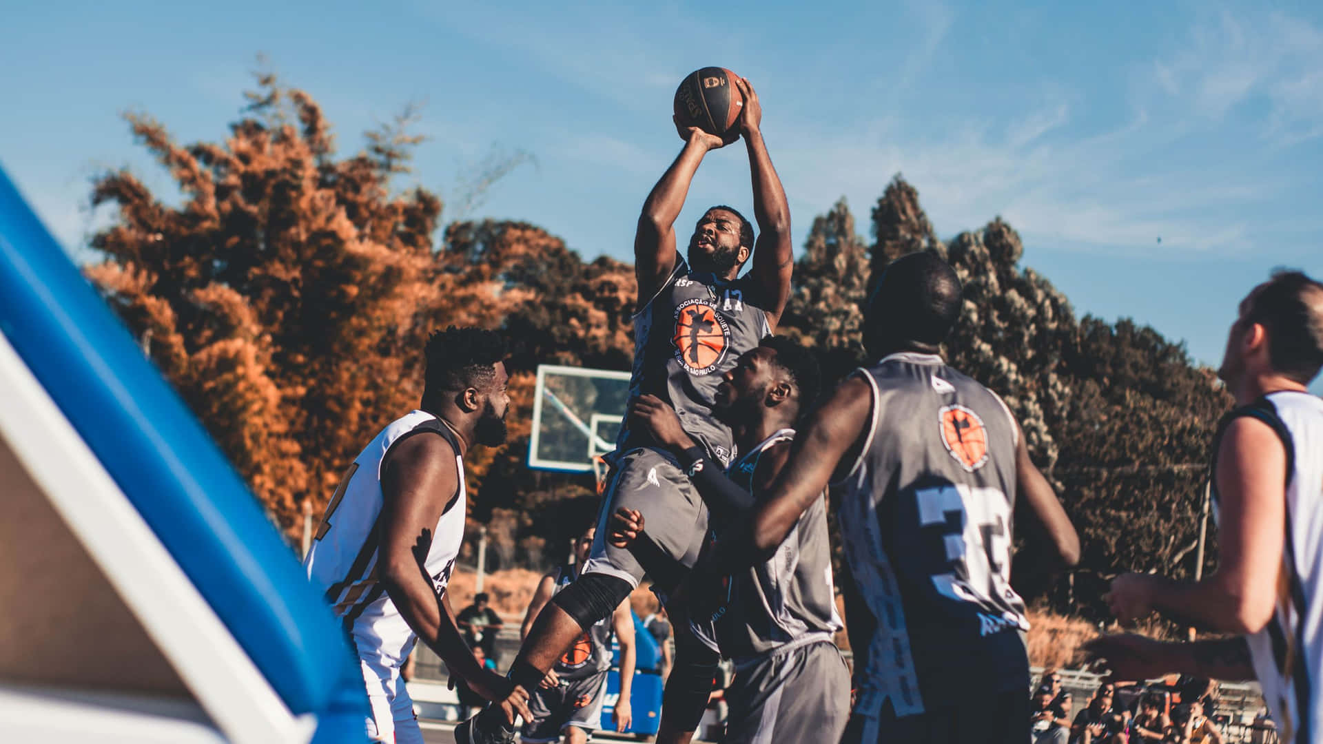 Kids Playing Basketball At The Park Background