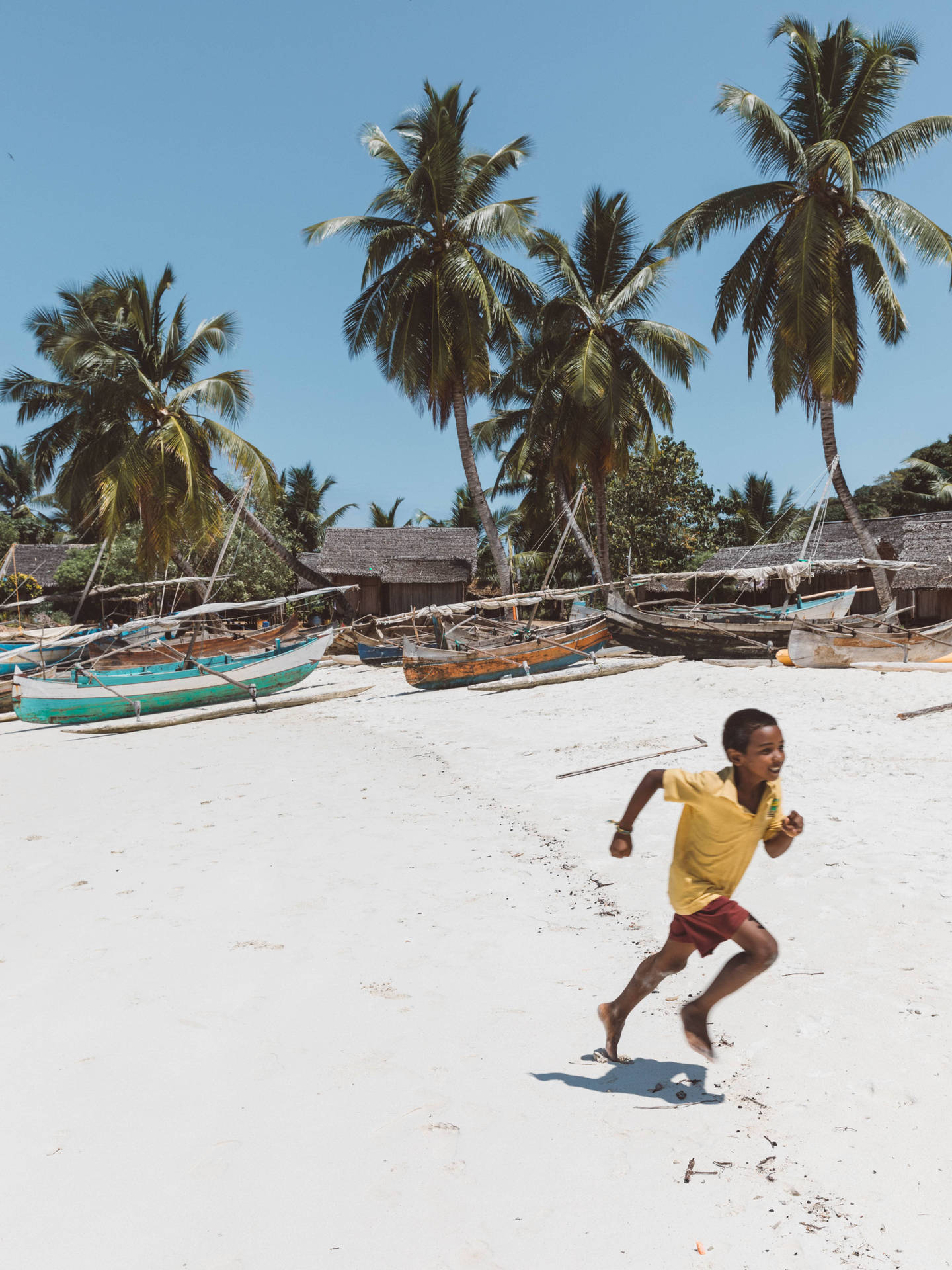 Kids Playing By Madadascar Beach Background