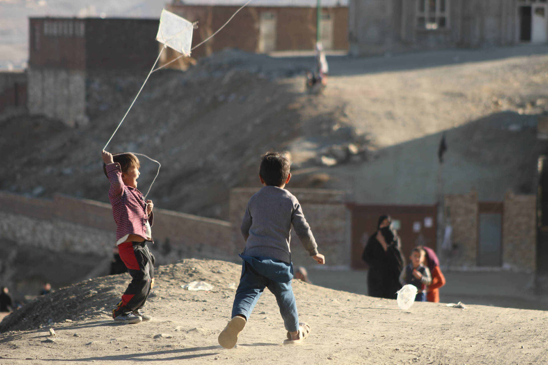 Kids Playing In Kabul Background