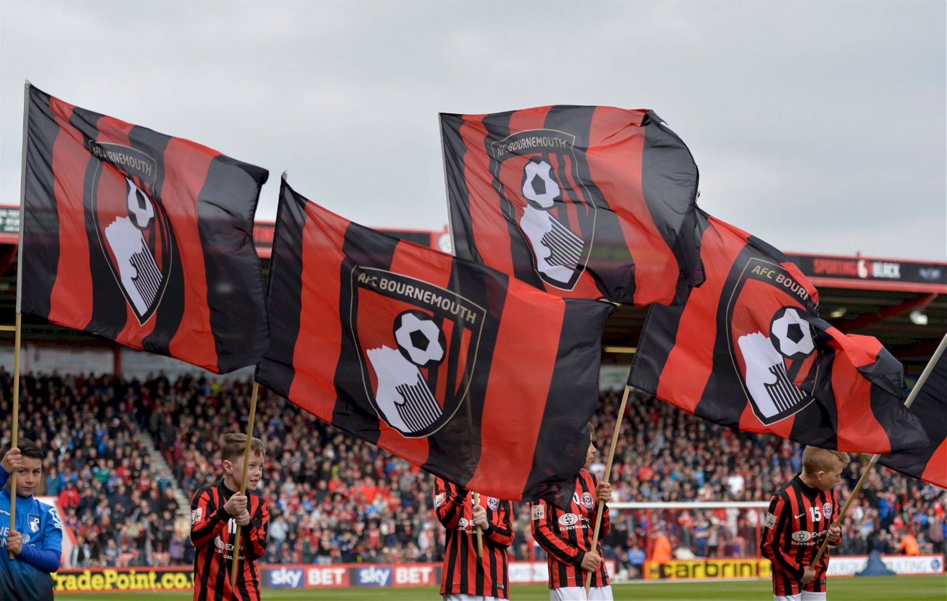 Kids Waving Afc Bournemouth Flag Background