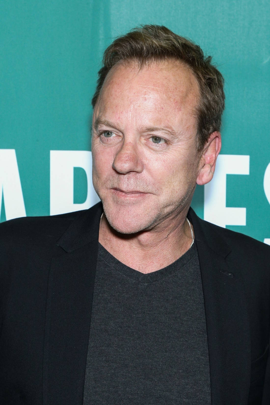 Kiefer Sutherland Posing Elegantly. Background