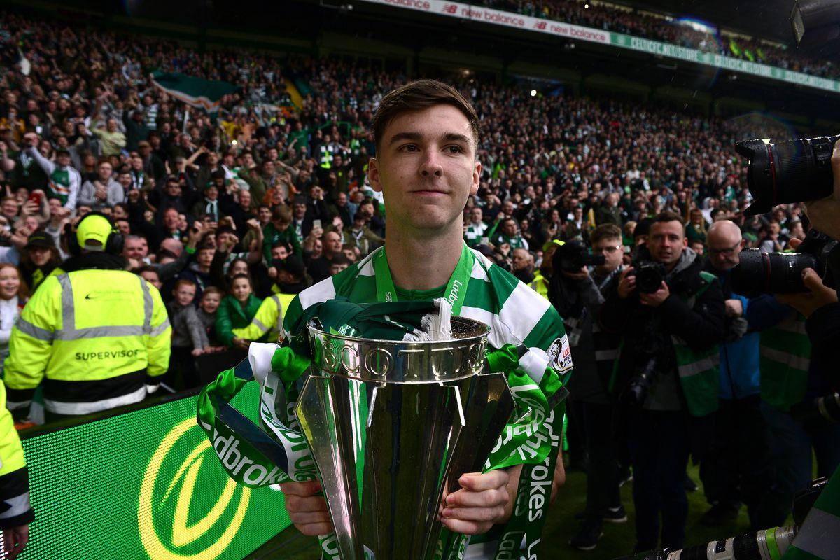 Kieran Tierney Holding A Trophy Background