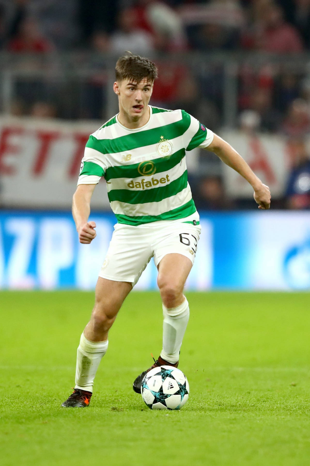 Kieran Tierney Kicking A Football Background