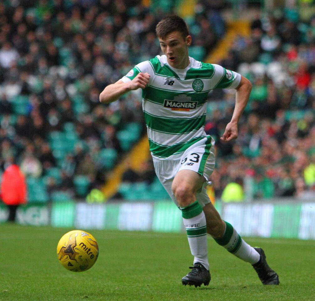 Kieran Tierney Running After A Ball Background