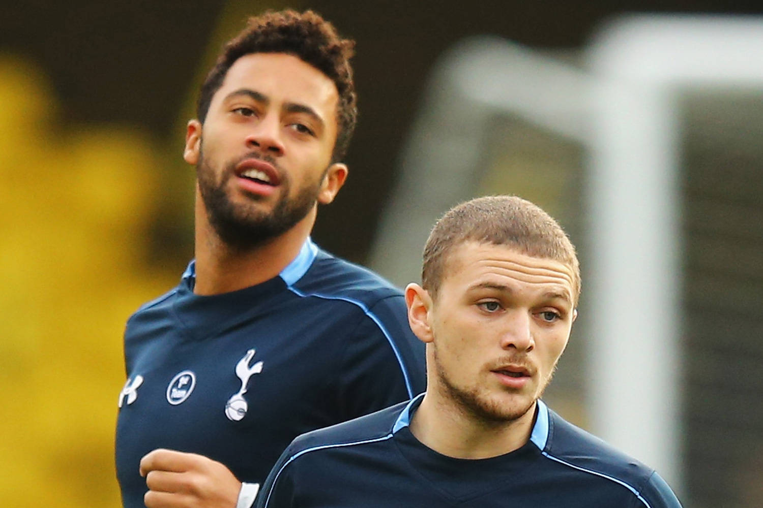 Kieran Trippier And Mousa Dembele On The Field Background