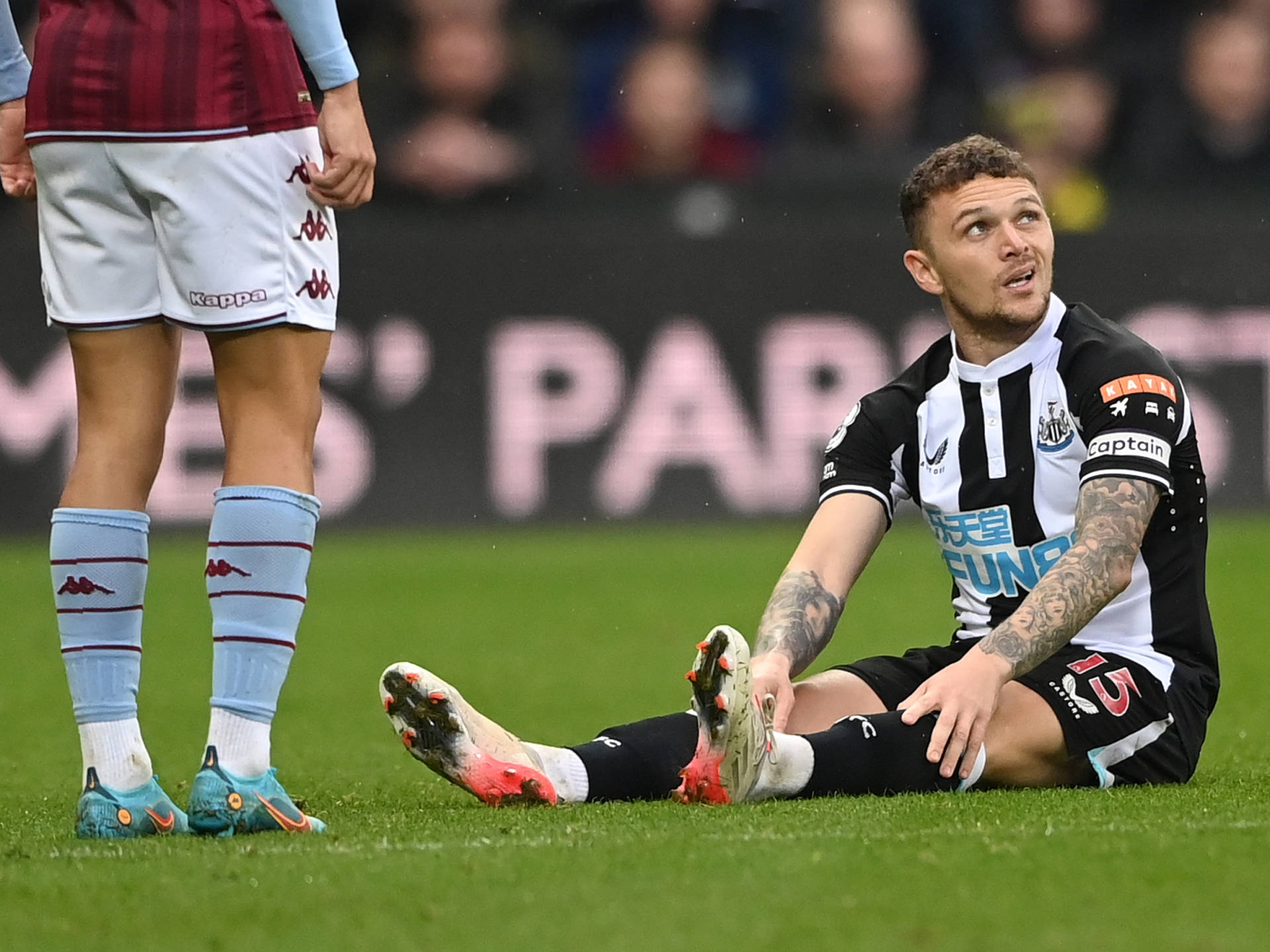 Kieran Trippier Sitting On Ground Background