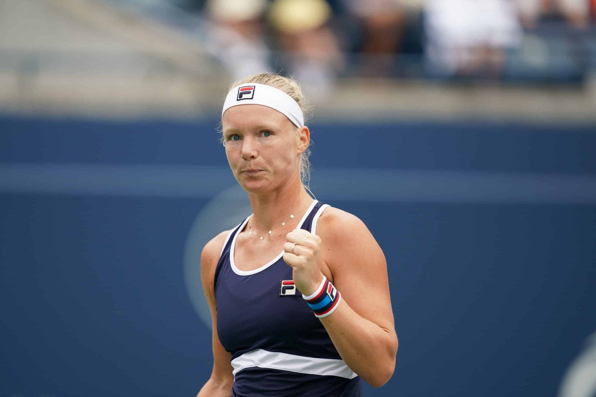 Kiki Bertens Celebrating A Win With A Low-key Fist Pump Background