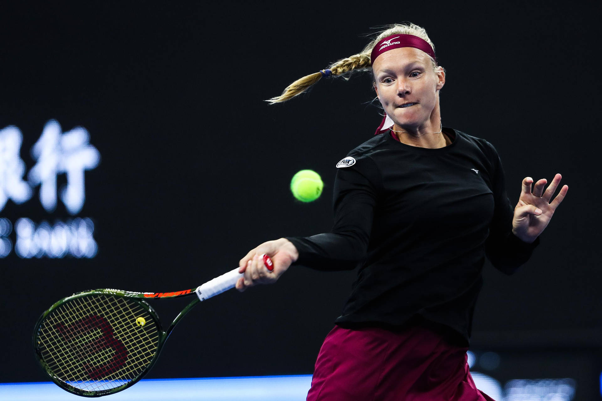 Kiki Bertens Executing A Powerful Forehand Stroke Background