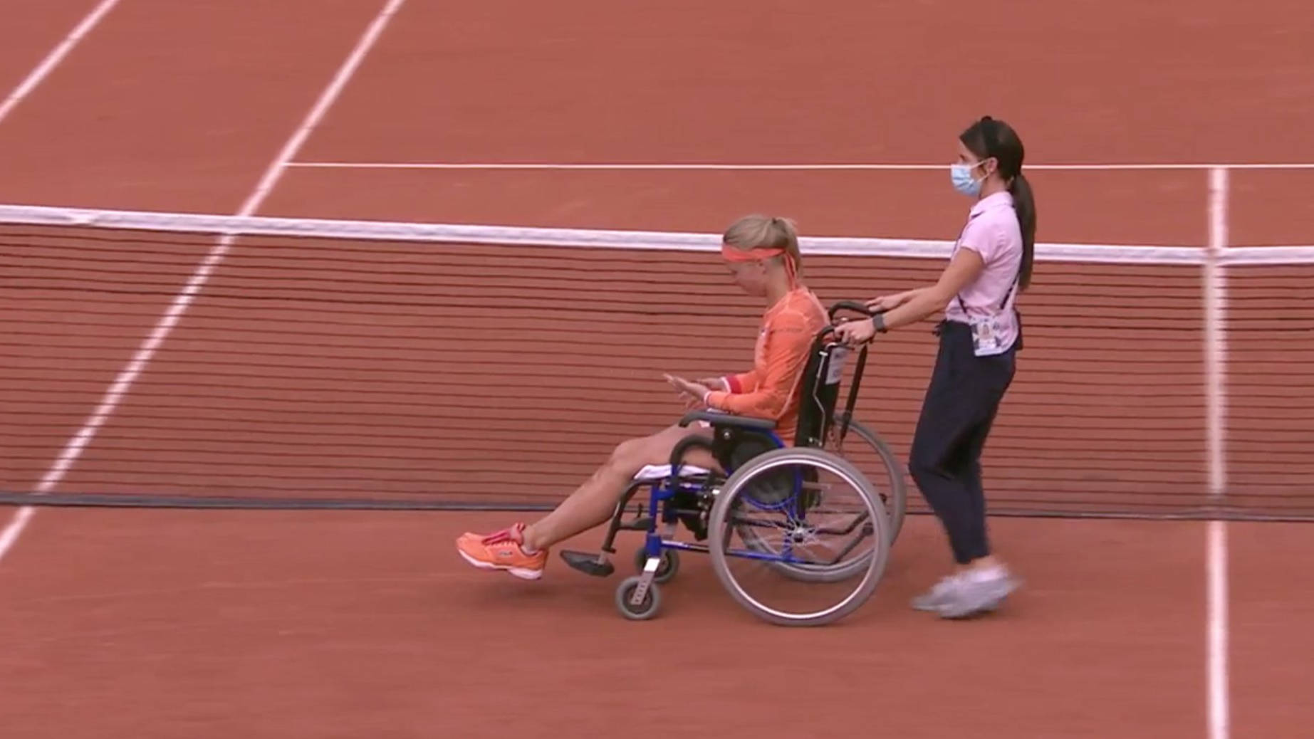 Kiki Bertens In A Wheelchair At A Tennis Tournament Background