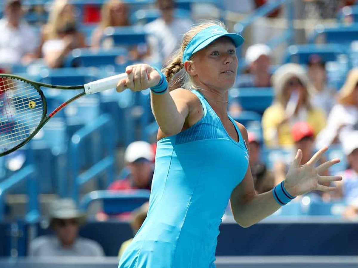 Kiki Bertens In Action At A Tennis Match Background