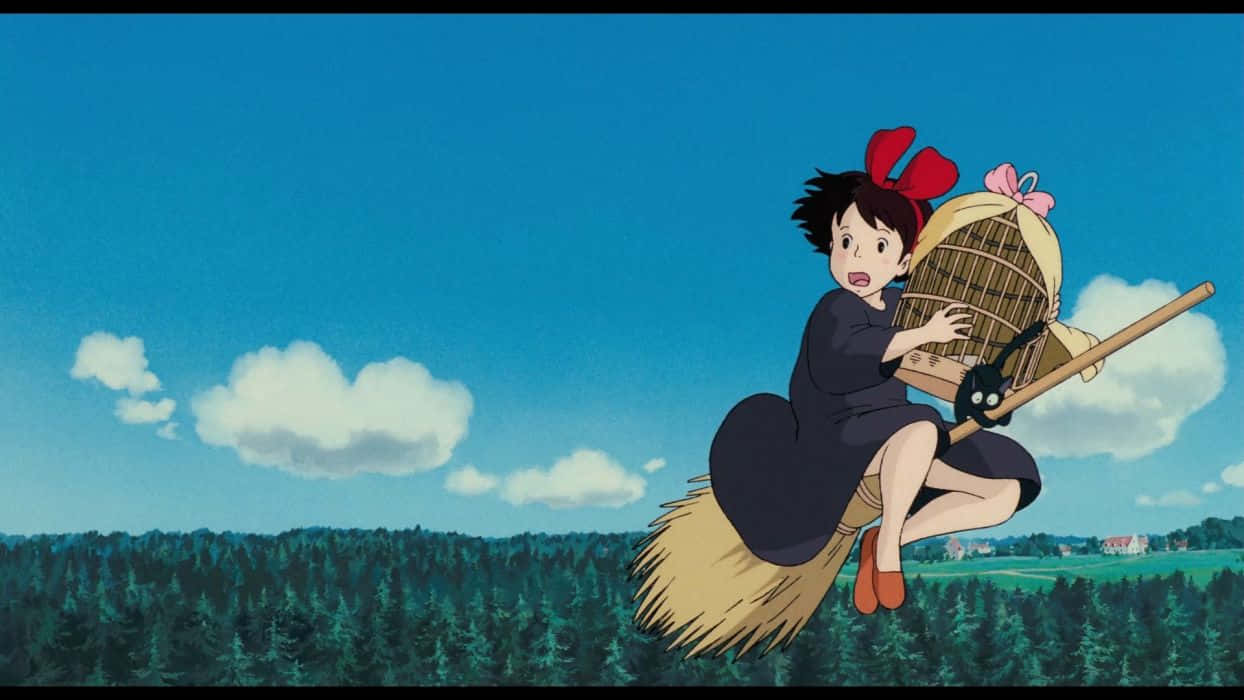 Kiki Flying On Her Broom With Jiji Over The Picturesque Coastal Town