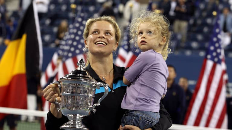 Kim Clijsters Celebrating With Her Sports Trophy Background