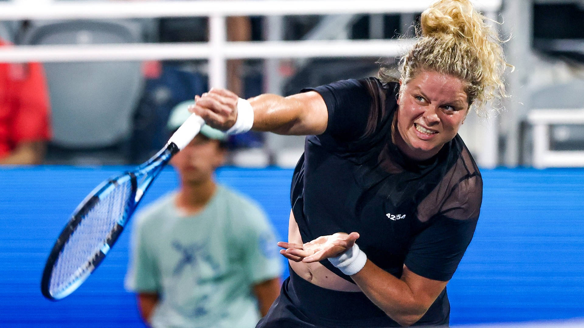 Kim Clijsters In Action: A Triumph Of Power And Grace Background