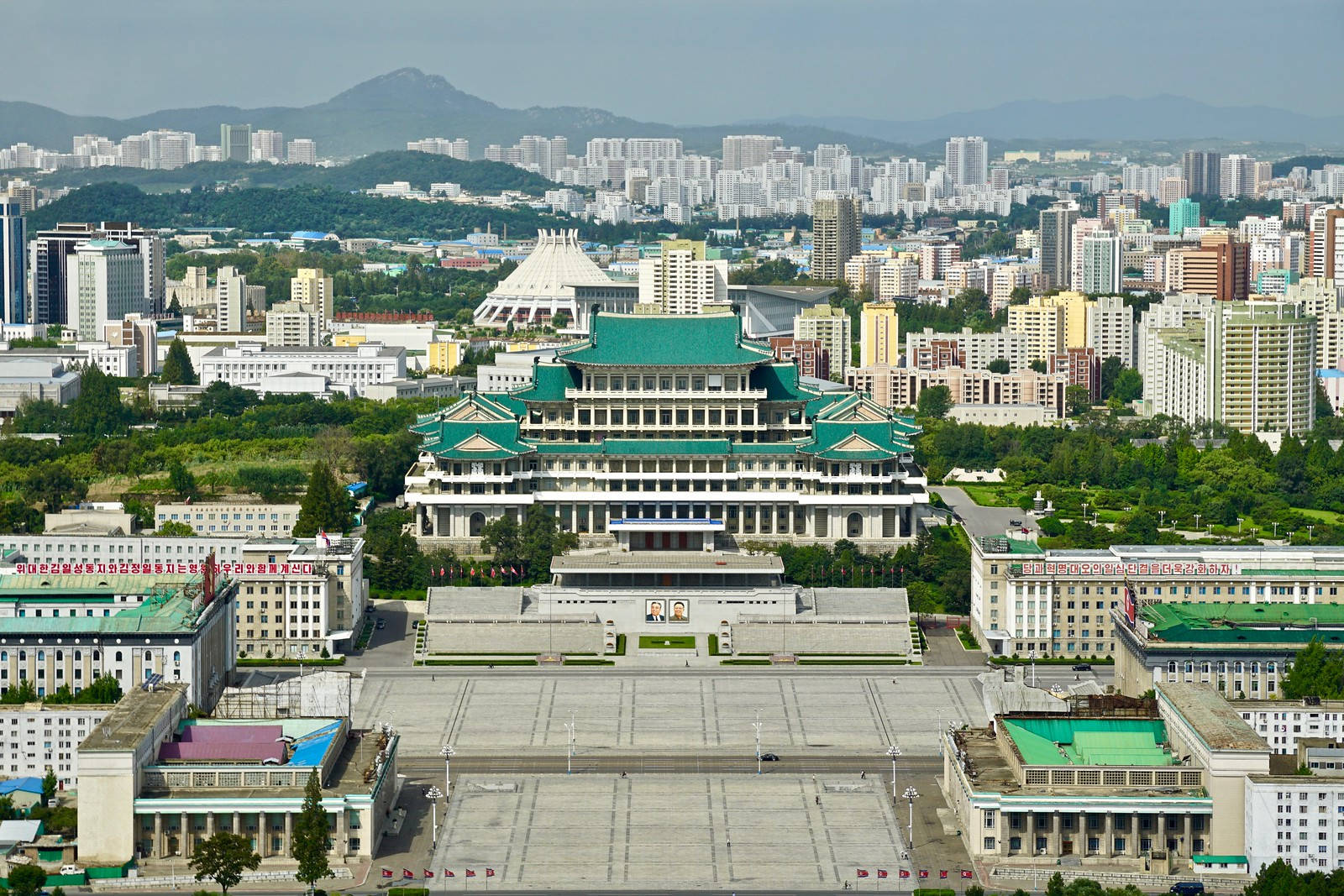 Kim Il-sung Square In Captivating Pyongyang City At Dusk Background