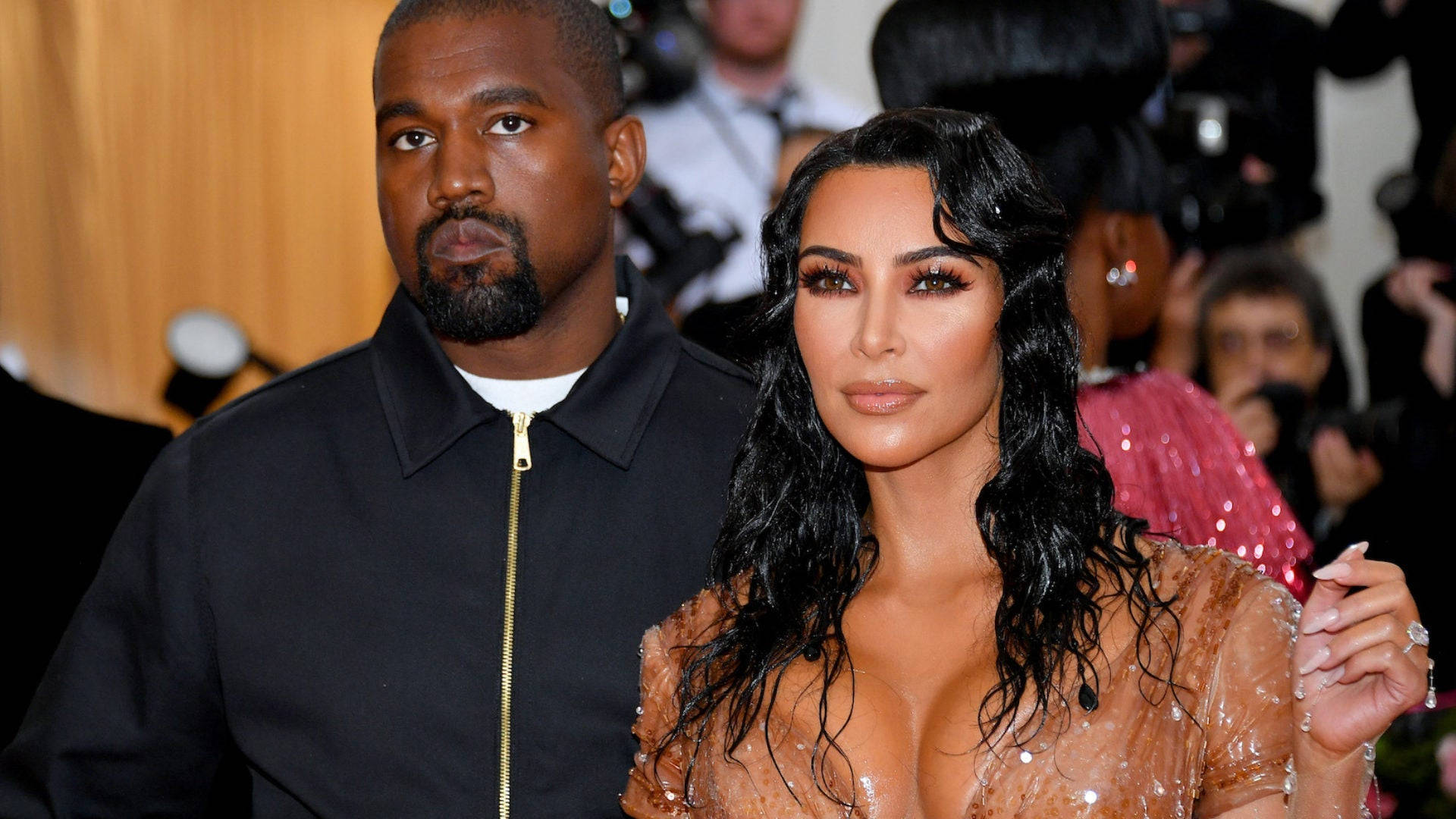Kim Kardashian And Kanye West Pose For A Photoshoot At The Met Gala Background