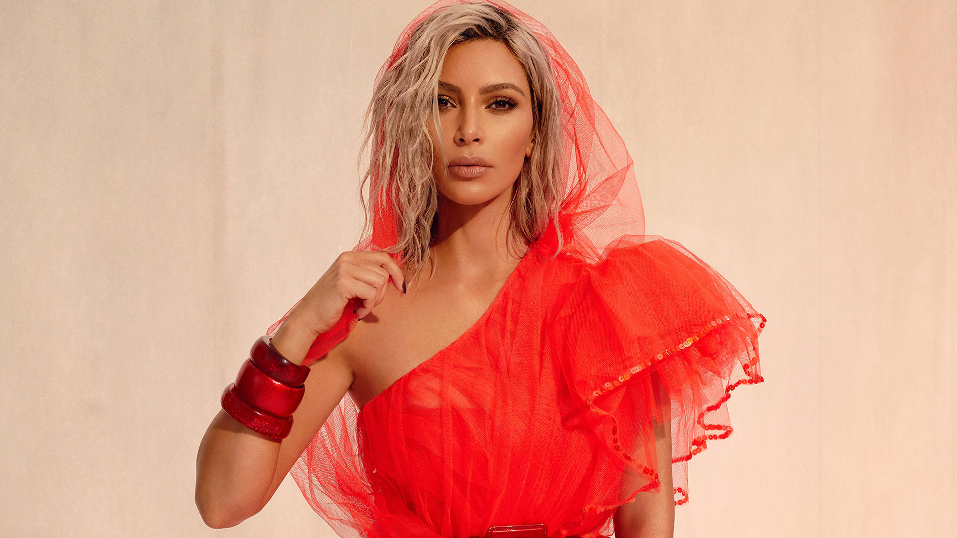 Kim Kardashian Flaunts Her Beauty In Red Tulle Background