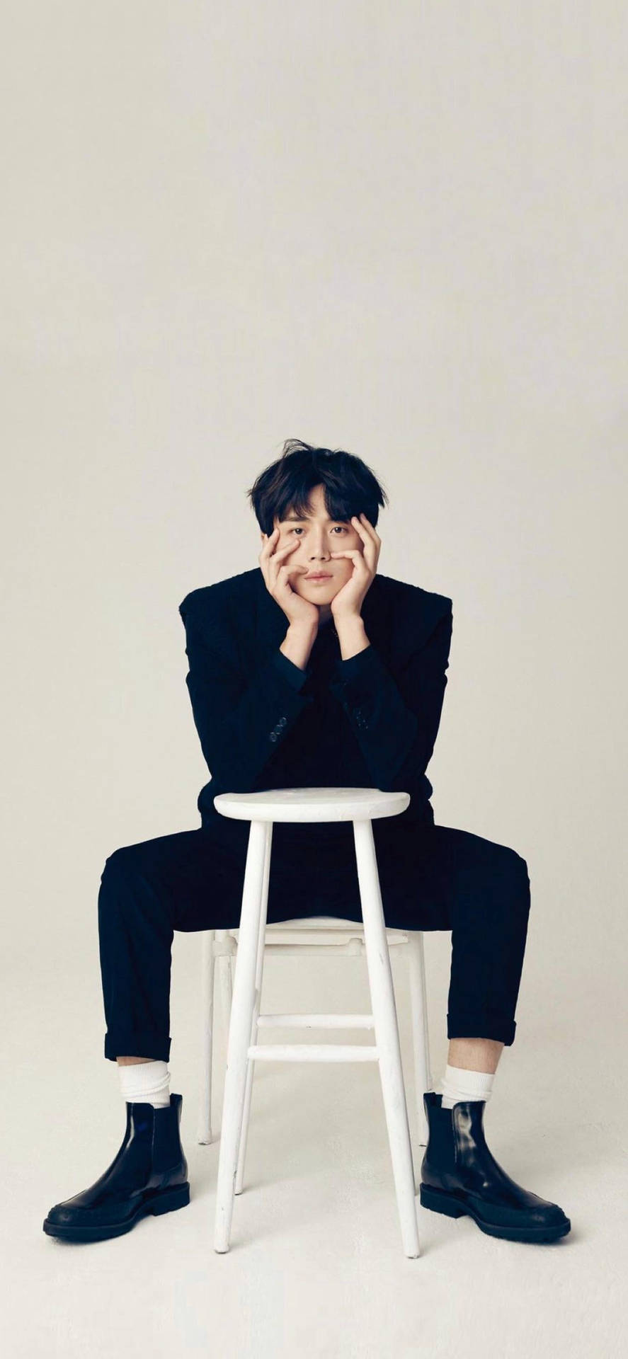 Kim Seon Ho Sitting Casually On A Chair. Background