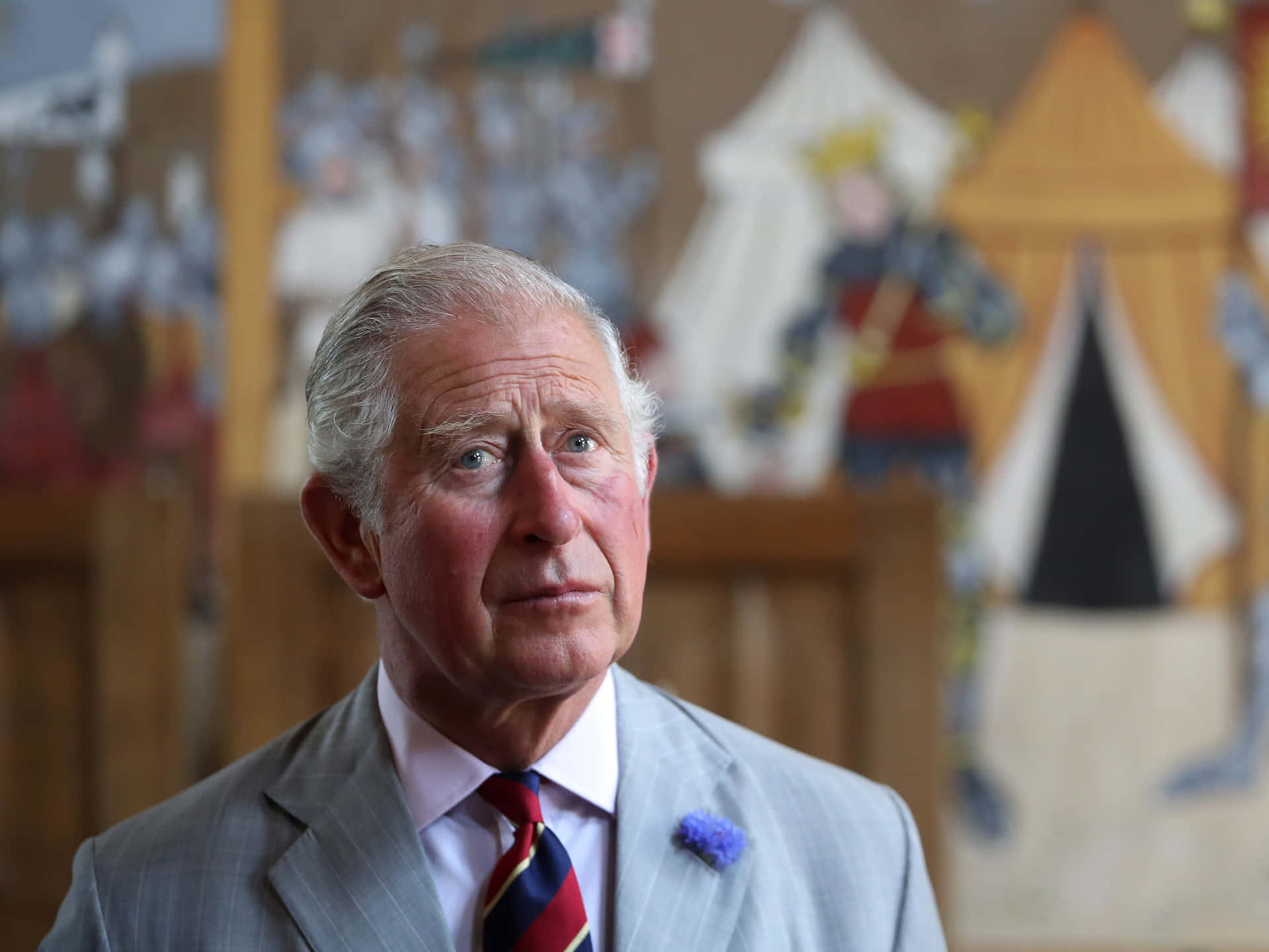 King Charles Iii With Blue Lapel Flower Background