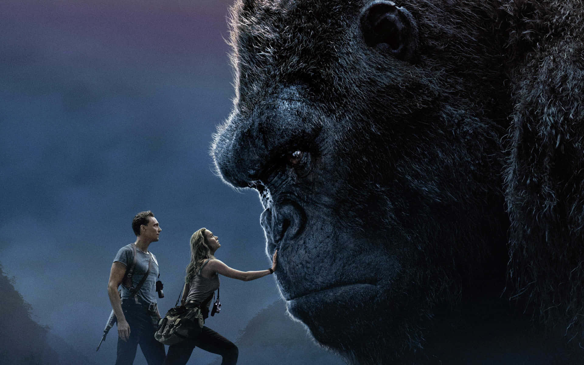 King Kong Roars As He Stands Atop A Skyscraper Background