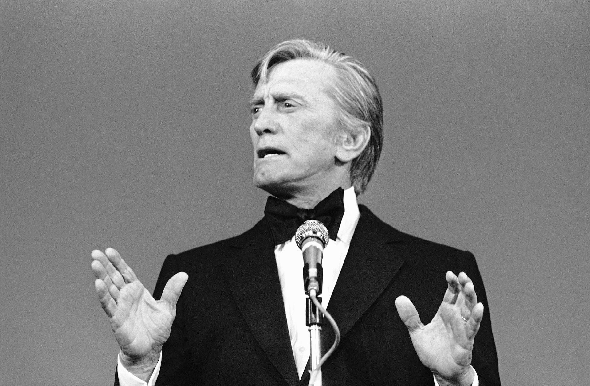 Kirk Douglas Speaking At The Cannes Film Festival Background