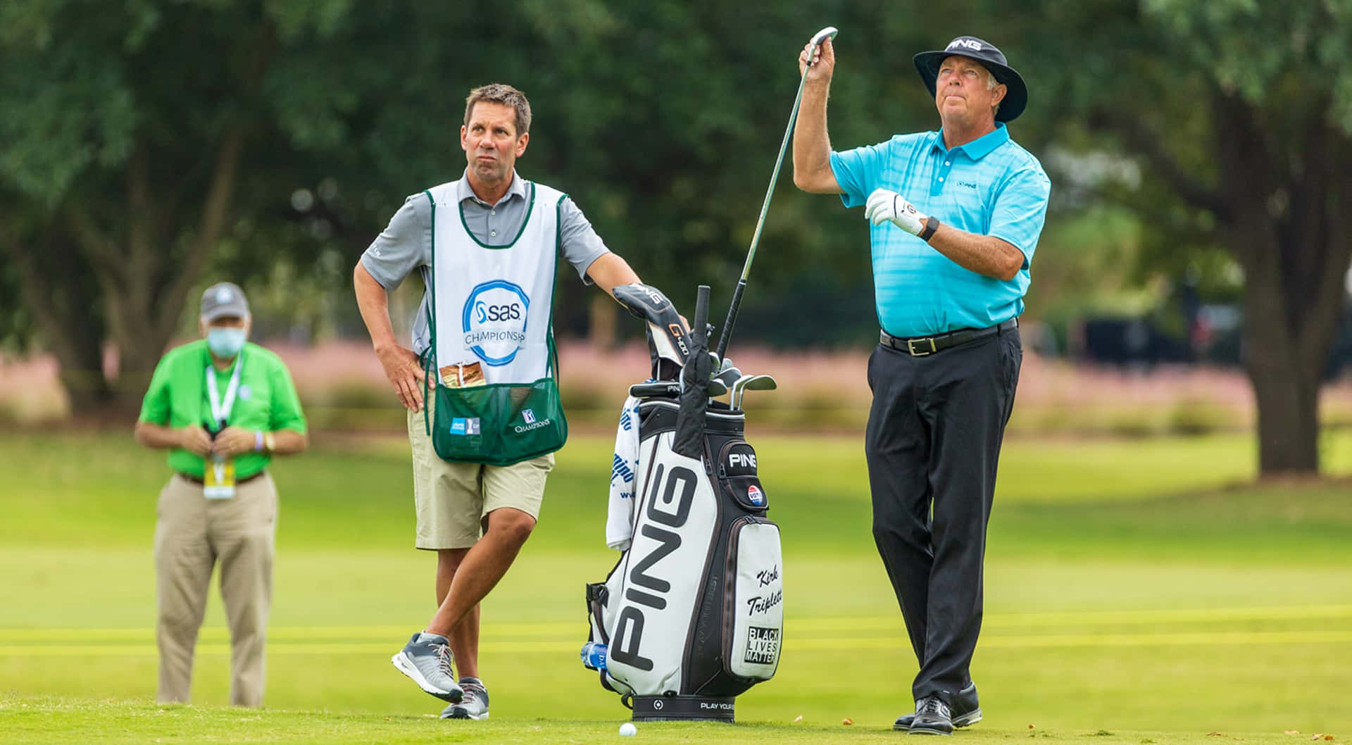 Kirk Triplett Pulling Out The Golf Club Background