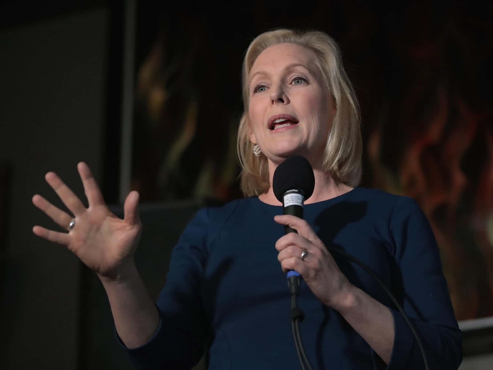 Kirsten Gillibrand Holding Microphone Background