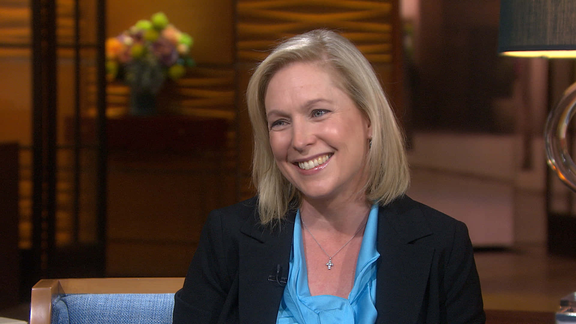 Kirsten Gillibrand Smiling During An Interview Background